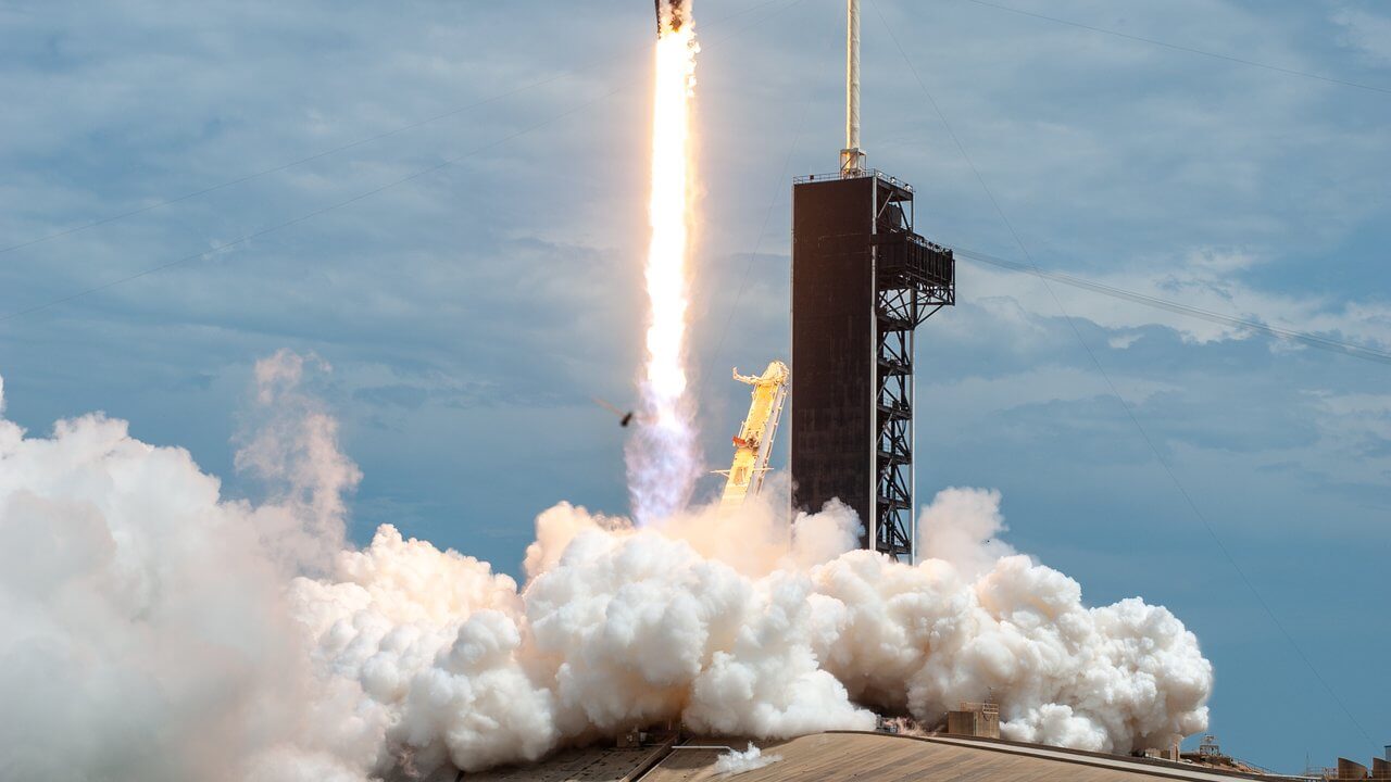 A SpaceX Falcon 9 rocket lifting off from Launch Complex 39A at NASA's Kennedy Space Center in Florida, carrying NASA astronauts on the Demo-2 mission in May 2020.